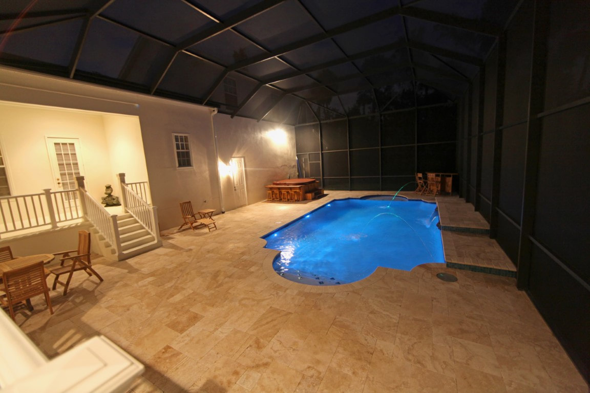 A picture of a lanai screen pool enclosure